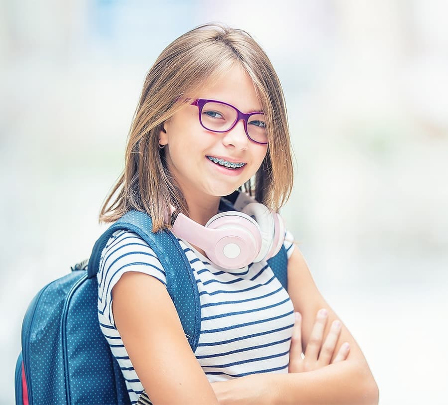 Happy child with braces smiling